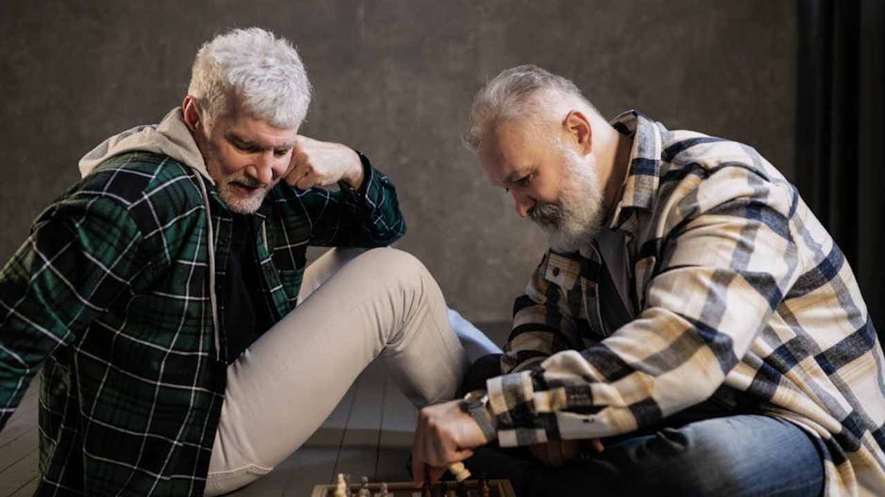 Esports team reviewing game strategy notes before a match