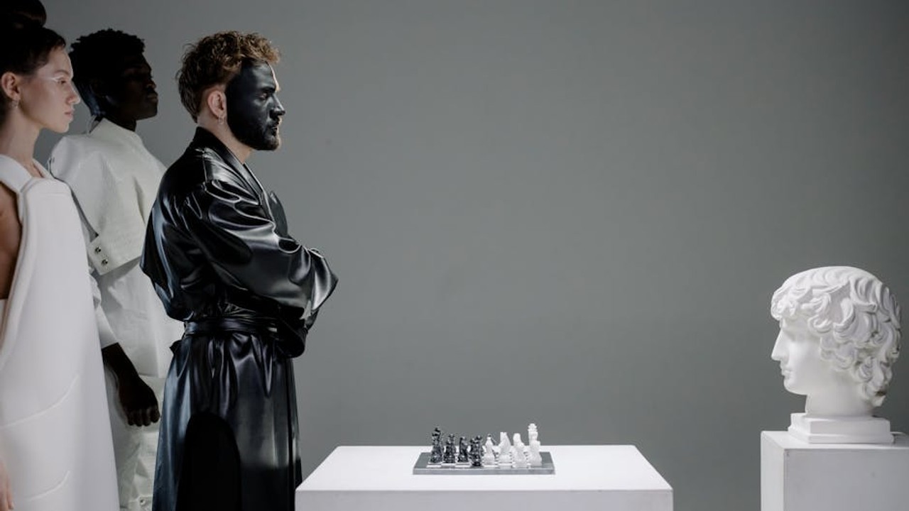 A Valorant coach drawing strategies on a digital whiteboard, explaining agent abilities and map control to a player.