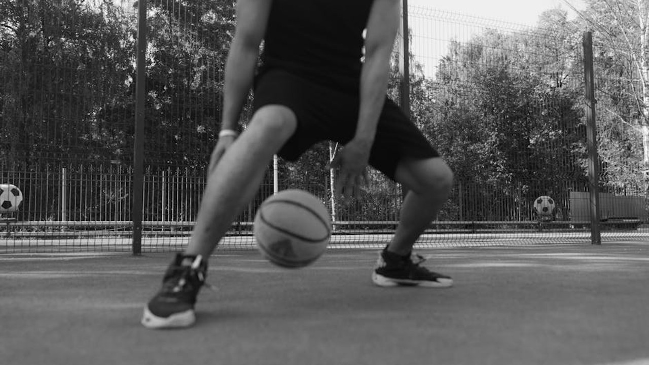 Person on a computer screen, diligently researching game reviews and gameplay footage before making a purchase decision