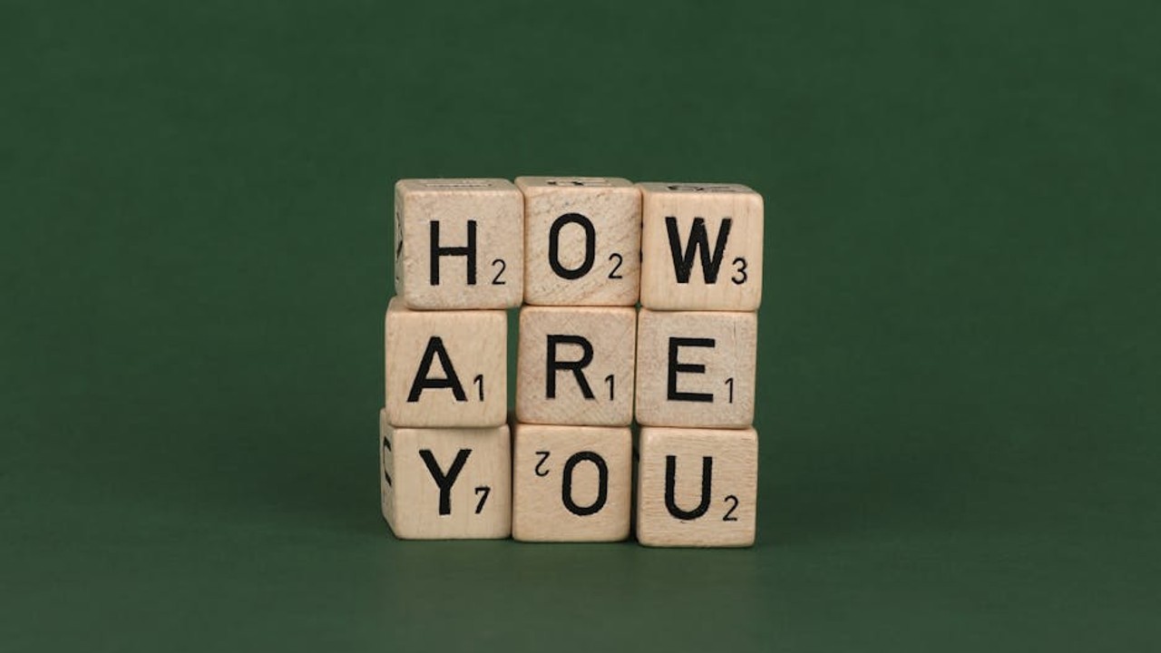 Gamers focused on screens, competing at a local esports cafe with vibrant RGB lighting