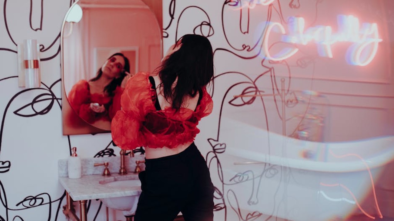 Streamer reacting live on Twitch with a vibrant chat overlay, showing active viewer interaction